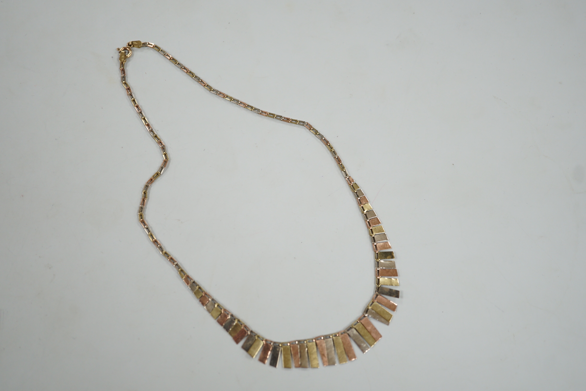 A modern three colour 9ct gold fringe necklace, 40cm